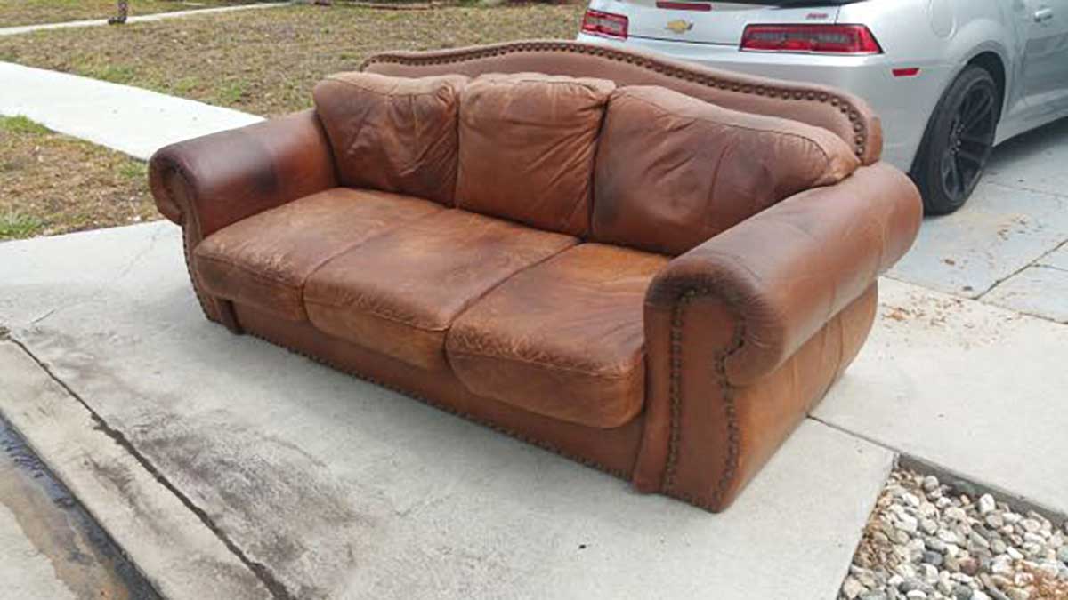 A Sofa discarded by Curbside